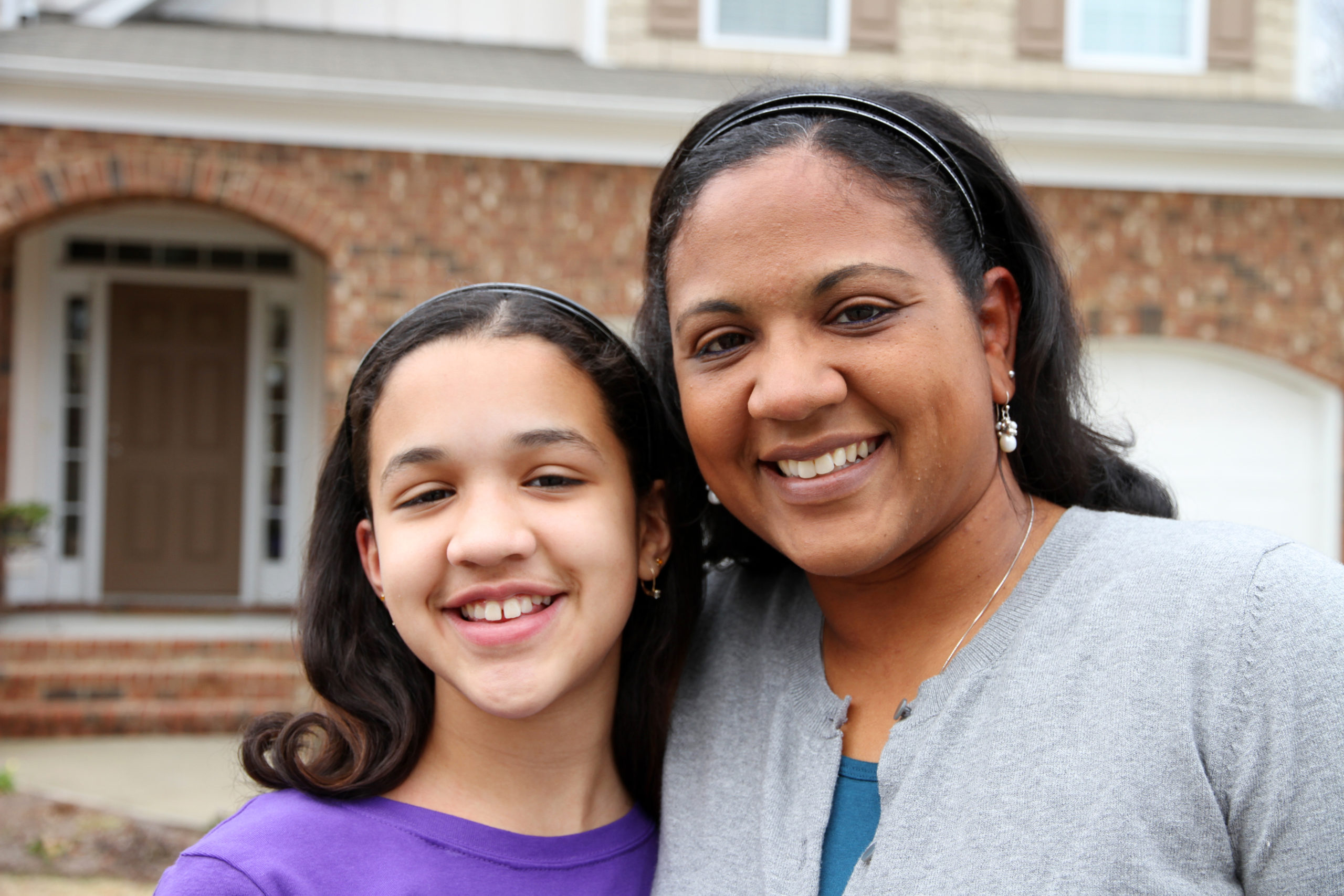 A,Mixed,Race,Mother,And,Daughter,At,Their,Home